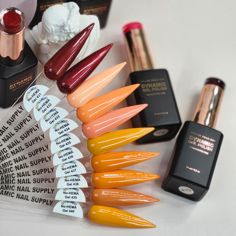 Ten Dynamic No-HEMA Gel Polish swatches (431–440 Fall Vibes) in warm hues shown beside gel bottles and a figurine.