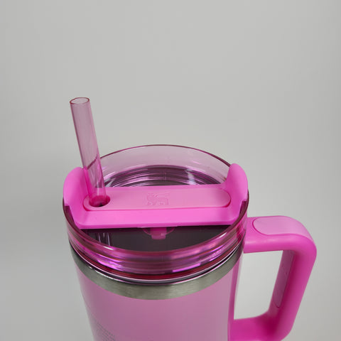 A 40oz Light Pink Stainless Steel Tumbler with lid, straw, and handle sits on a light gray background.