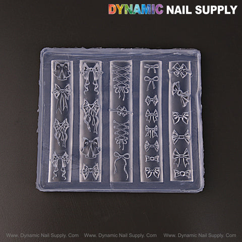 Mixed Style Bow Charms—3D Nail Art Silicone Mold for custom embossed charms, perfect DIY nail tool on black display.