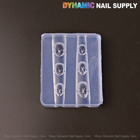 The Mixed Size Human Heads 3D silicone nail mold creates embossed head charms for custom nail art, shown on black.