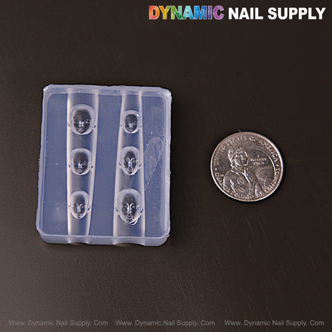 Mixed Size Human Heads 3D Nail Art Silicone Charm Mold with five cavities shown beside a U.S. quarter; DYNAMIC NAIL SUPPLY at top.