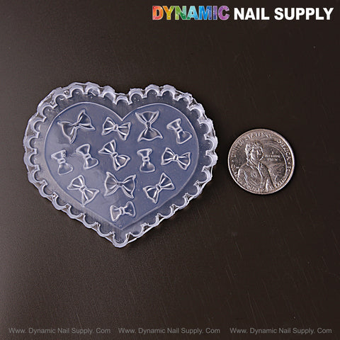 MIxed Size Fluffy Bows 3D Nail Art Silicone Mold for custom embossed charms, shown next to a US quarter.
