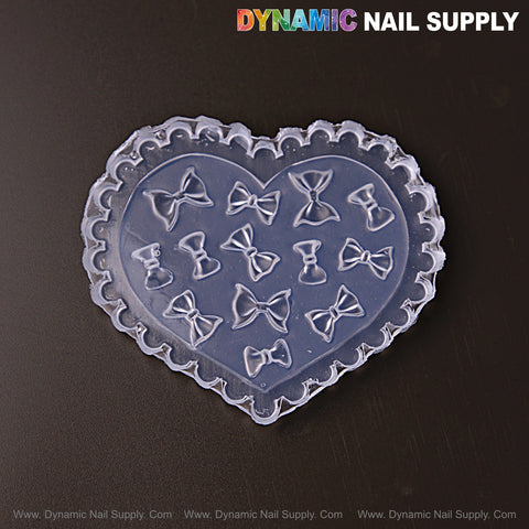 MIxed Size Fluffy Bows 3D Silicone Mold for embossed nail charms, DIY nail art tools—Dynamic Nail Supply logo above.