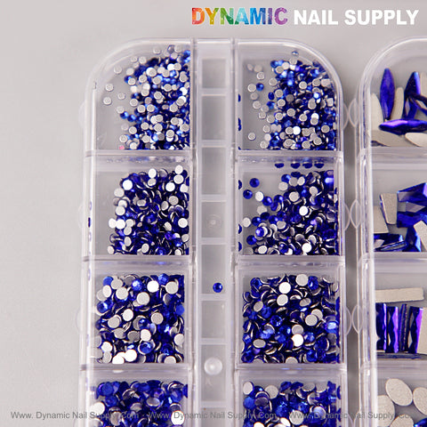 A plastic case of blue multi-shape nail crystal rhinestones—flat back, with kit—for dazzling nail art decorations.