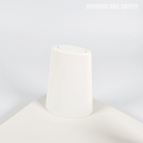 A white cap beside a Pink Marble U-SHAPE Microfiber Leather Armrest Cushion Pillow for manicure.