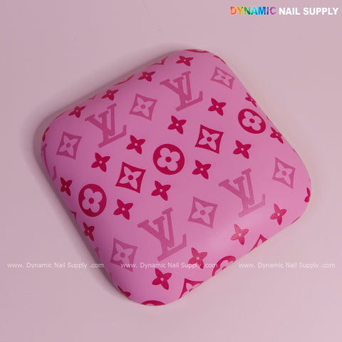 Pink and pink LV smooth leather elbow cushion pad arm rest support for manicure nail desk; logo in top right corner.
