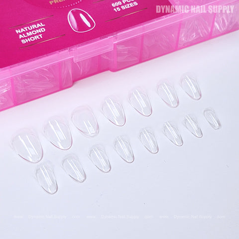 Natural Almond (Short) Full Cover Soft-Gel Tips are shown below a pink Dynamic Nail Supply box.