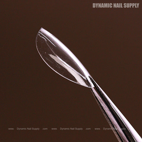 A clear Natural Almond (Short) Soft-Gel Nail Tip held by tweezers; Dynamic Nail Supply text in the corner.