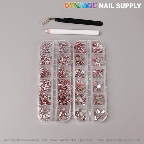 Two trays of pink nail gems from the Multi Shape Size Nail Crystal Gem Set, white pencil, and black tweezers on gray.