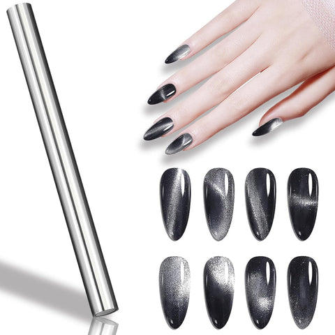 A hand with long, oval-shaped nails is adorned in Dynamic Nail Supply's Icy Cat Eye Gel, a Reflective Magnetic Silver Shimmery Gel Polish with a glossy finish. Below the hand are eight nail swatches showcasing the same icy cat eye effect. To the left, a cylindrical silver roll hints at dazzling nail art possibilities against a white background.