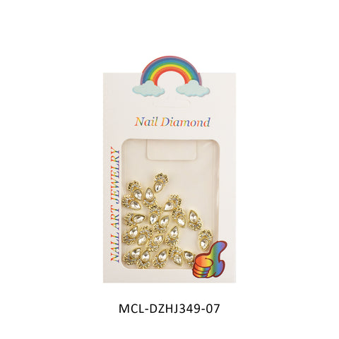 A package from Dynamic Nail Supply labeled "20 pcs / 1 bag of Unique Shape Charms for Nails Art Design" features distinct charms adorned with gold teardrop embellishments, stars, and rhinestone designs. The packaging includes a rainbow and cloud graphic at the top with a multicolored heart on the bottom right corner, alongside text that reads "Nail Art Jewelry" on the side. Product code: MCL-DZHJ349-07.