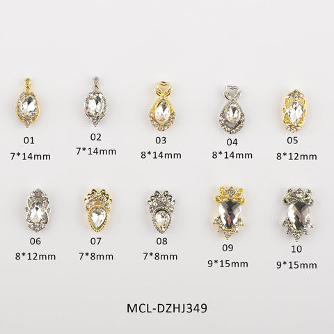 The Dynamic Nail Supply offers a collection of 20 decorative jewelry pieces, ideal for nail designers. Each piece, uniquely labeled from 01 to 10, features a central clear gem set in ornate gold or silver settings and comes in sizes varying from 7*14mm to 9*15mm. The charms showcase intricate details such as bead-like borders and prong settings on a white backdrop.