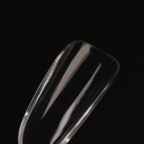 A close-up of Natural Round (Medium) Full Cover Soft-Gel Nail Tips (Pink Box) against a black background.