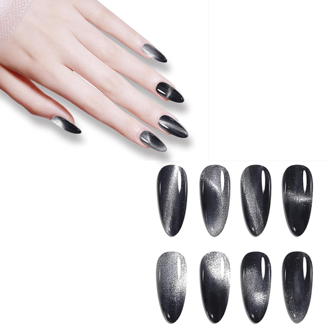 A hand adorned with long, stiletto-shaped nails painted in glossy black exhibits the captivating reflective silver gradient effect of the Icy Cat Eye Gel from Dynamic Nail Supply. Below, seven false nails showcase the same gel polish, highlighting its icy cat eye gel shimmer against a crisp white background.