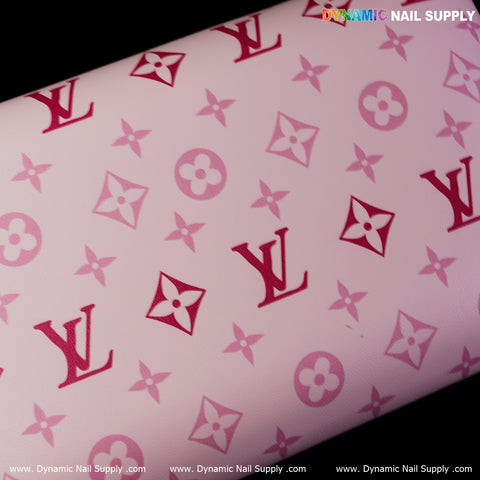 Close-up of (R-016) Armrest for Nail Table Pedicure Services with pink monogram and Dynamic Nail Supply logo.