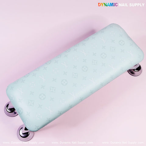 Light blue R-011 PU leather armrest with pillow for manicures, patterned, on metal legs, DYNAMIC NAIL SUPPLY text.