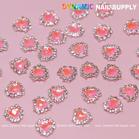 Add flair to nails with 30 pcs 3D Pink Ruby Heart Rhinestone Charms—pink stones, silver base, perfect for nail art.