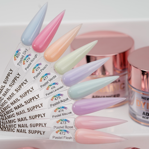 Eight labeled pastel swatches from the New 2026 Pastel Spring Colors Acrylic Collection sit by jars with rose gold lids.