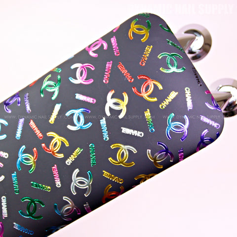 The (RM008 - Multi-colors CC Pattern) armrest is a chic, branded accessory for hand and foot nail care.
