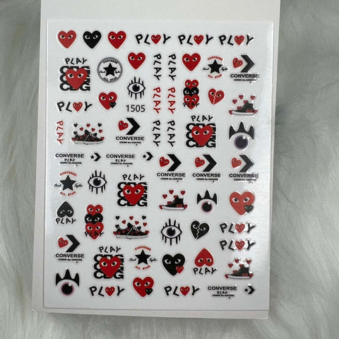 The Logo Sticker for nails art design by Dynamic Nail Supply offers a lively collection of playful nail stickers featuring designs such as red hearts with eyes, black stars, and the words PLAY and Converse. Perfect for a quick peel-and-stick manicure, these stickers are neatly arranged in a grid on a pristine white background.