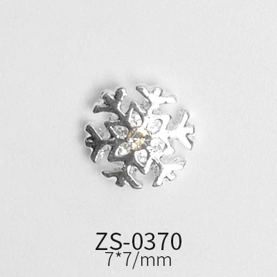 A small, metallic snowflake charm featuring a clear, sparkly gem at its center is showcased against a simple background. Below the charm, the text displays "ZS-0370" and "7*7/mm," representing the product code and dimensions. Offered by Dynamic Nail Supply as part of their 24pcs Snowflake Charms for Winter and Christmas nails art design collection, these charms can be used to add unique accents to your nail designs.