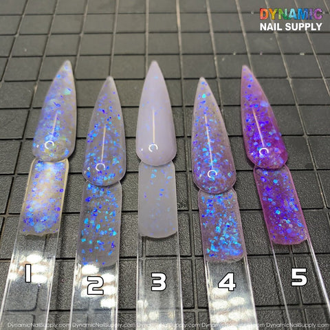 Five pointed oval nail polish swatches labeled 1 to 5 display glitter effects, featuring a translucent base with varying blue and pink iridescent flakes. The tips vary from pale to vibrant colors. Set against a black grid mat, the Explicit series - Dirty Sprite - Glitter Acrylic Powder Collection by Dynamic Nail Supply is highlighted in the top right corner, ideal for fans of sculpting and dipping nails.