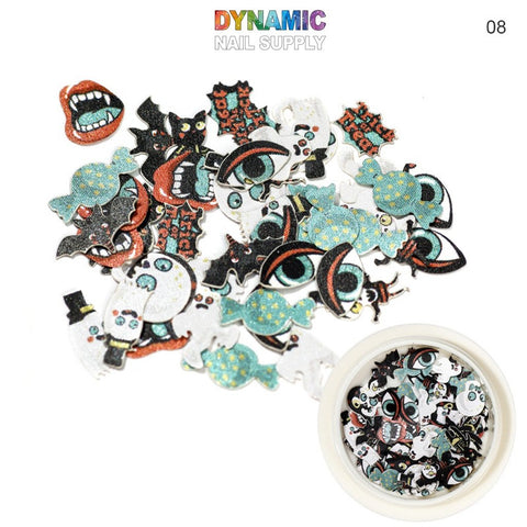 The Halloween Sequins for Nail Art Design by Dynamic Nail Supply includes a variety of vibrant decals featuring dynamic designs such as vampire mouths, bats, eyes, ghosts, and pumpkins. An open container at the bottom right holds additional sequins. The text "Dynamic Nail Supply" is displayed at the top with the number 08 on the right.