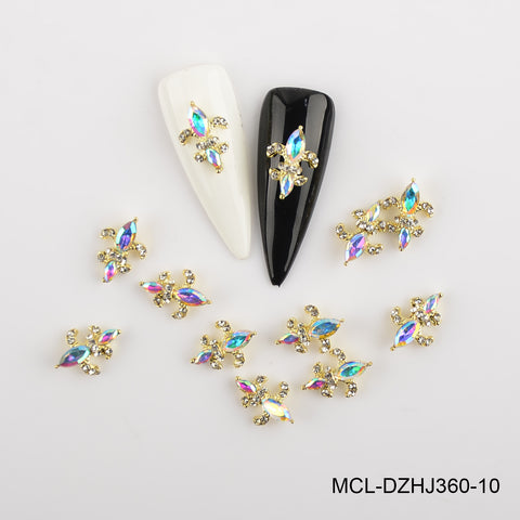 20pcs Saint Fleur De Lis charms in 12 colors by Dynamic Nail Supply, shown on white and black nail tips.