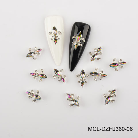 Twenty Saint Fleur De Lis charms (12 color options) with black and white nail tips from Dynamic Nail Supply shown.