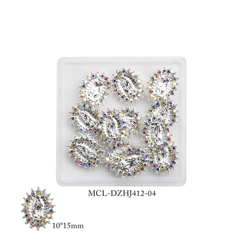 A set of twelve Virgin Mary charms from Dynamic Nail Supply, designed for religious nail art, features oval rhinestones with a silver base. Each charm is embellished with colorful accent stones forming a halo around a central clear gem, showcasing elegance and grace. Presented on a white tray, the image includes product code MCL-DZHJ412-04 and dimensions 10*15mm at the bottom.