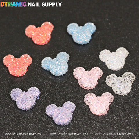 10 pcs Gummy/Sugar Candy Mickey Mouse Design Nail Charms sparkle in pastel colors on a black background.