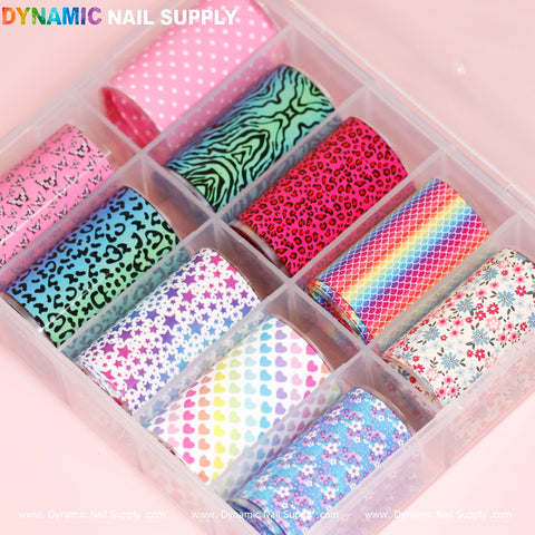 The "Nail Art Design Foils - Colorful" by Dynamic Nail Supply come in a clear plastic container and include ten rolls featuring designs such as pink butterflies, pink polka dots, green zebra stripes, pink leopard print, rainbow scales, purple stars, multicolored hearts, purple dots, blue floral designs, and red flowers on white.