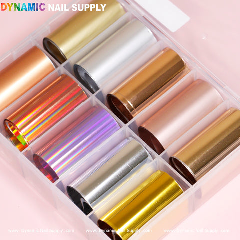 The Nail Art Design Foils - Metallic Style set from Dynamic Nail Supply features ten rolls of metallic and holographic design foils housed in a clear plastic container. With vibrant colors such as gold, silver, rose gold, copper, and iridescent, each roll is perfect for boosting your creativity. The container displays the Dynamic Nail Supply brand name against a light pink background.