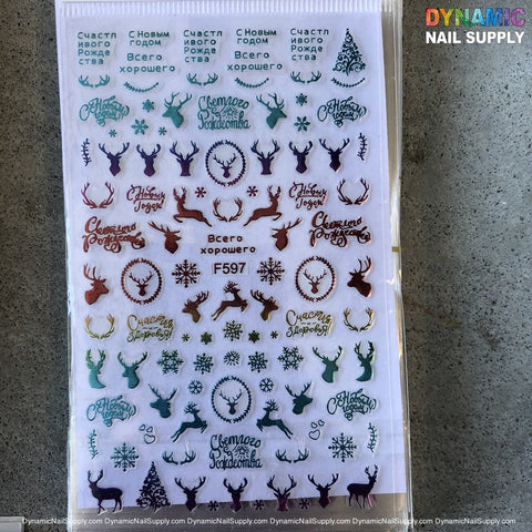 Introducing the NAIL ART STICKERS - CHRISTMAS NAILS STICKER - F597 by Dynamic Nail Supply, featuring an array of festive designs such as deer heads in dark green, red, and gold, snowflakes, and Russian holiday greetings in various fonts. These intricate patterns beautifully complement the gray background, making them perfect for your seasonal nail art needs.