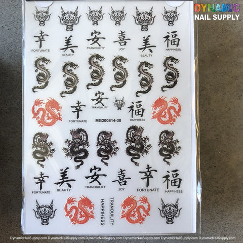 A sheet of NAIL ART STICKERS - DRAGON STICKERS - SNAKE STICKER - MG200814-30 showcases detailed designs, including black and red dragons with Chinese characters representing Fortunate, Beauty, Tranquility, Joy, and Happiness on a plain speckled background. The branding reads Dynamic Nail Supply.