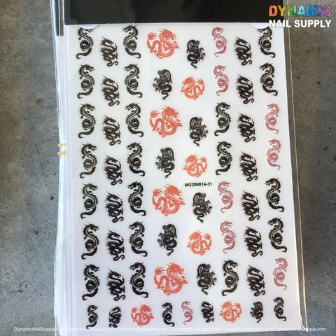 A sheet of NAIL ART STICKERS by Dynamic Nail Supply showcases black and red dragon designs aligned in rows. Each dragon is intricately detailed with scales and curves, embodying an oriental art style against a neutral gray background.