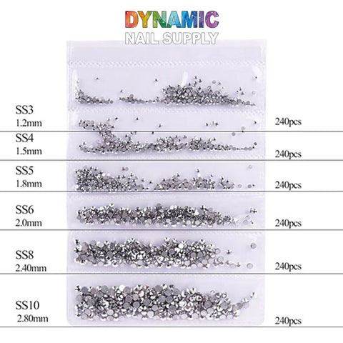 Image of QH0250 Nail Art Rhinestones 3D Gems Decorations by Dynamic Nail Supply, ideal for nail art enthusiasts. This set includes six rows of silver rhinestones in clear compartments, with sizes ranging from SS3 to SS10. Each size contains 240 pieces, measuring between 1.2mm and 2.8mm, perfect for creating stunning 3D gem decorations.
