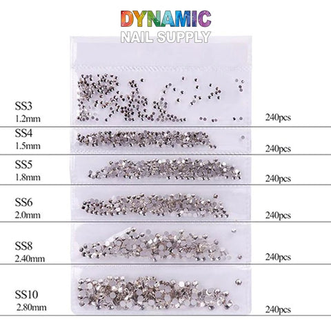 Image showcasing the QH0250 Nail Art Rhinestones 3D Gems Decorations, featuring silver nail rhinestones in sizes from SS3 to SS10, ideal for stunning nail art and 3D gems decorations. Each clear plastic bag contains 240 pieces with sizes ranging from 1.3mm to 2.8mm. The top is adorned with the brand name Dynamic Nail Supply in vibrant letters.