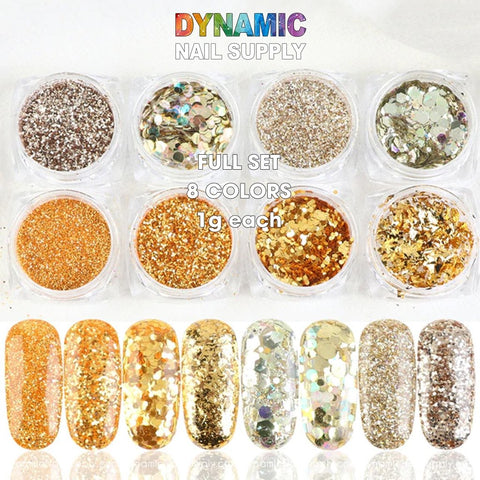 The image showcases a set of eight small containers filled with assorted gold and silver glitter powders from Dynamic Nail Supply, as part of the QH15060 SET 14 Holographic Nail Art Glitter Set. Each 1g container is accompanied by sample nail swatches that display holographic nail art variations from gold to silver, under text stating FULL SET 8 COLORS.