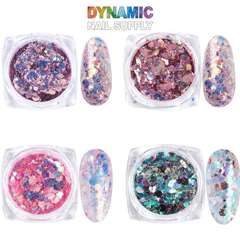 The QH15060 SET 19 Holographic Nail Art Glitter Set Powder from Dynamic Nail Supply includes four containers of glitter nail powders, each paired with matching swatches. The top row highlights purple and pink combinations, while the bottom row displays blends of pink and green. This glitter set is a must-have for nail art enthusiasts, featuring a unique mix of fine glitter and larger hexagonal pieces.