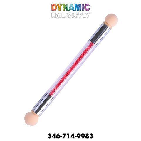Introducing the QH9280 Gradient Glitter Powder Nail Brush Sponge Double Head Dotting Pen by Dynamic Nail Supply. This versatile nail art tool features two beige sponge tips perfect for creating gradient glitter effects. It includes inner pink beads encased in a clear tube, accented by silver connectors. The Dynamic Nail Supply logo in colorful text is elegantly displayed above the dotting pen, alongside the contact number 346-714-9983 on a simple white background.
