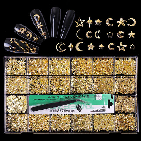The DH040 Gold Metal Sequins & Rivets with Moon and Star shapes from Dynamic Nail Supply showcases an assortment of gold nail art design decorations, such as stars, moons, hearts, and planets on black nails. It comes with 20 different styles stored in a box for varied combinations. A tweezer is included for easy application.