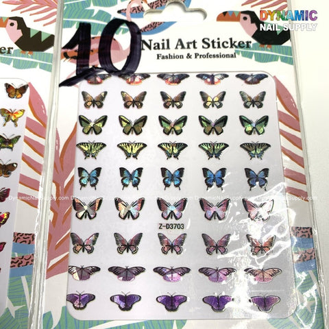 A pack of "Butterfly Stickers for Nails Art Design - 10" from Dynamic Nail Supply includes vibrant designs perfect for both fashion enthusiasts and professionals. The packaging, with the Dynamic Nail Supply logo prominently displayed in the top right corner, features a variety of butterfly stickers in different sizes and colors to accommodate diverse nail art styles.