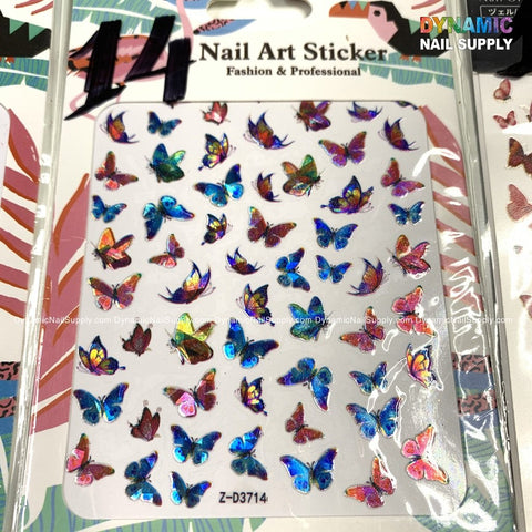 A sheet of Dynamic Nail Supply's "Butterfly stickers for nails art design" features an array of vibrant iridescent butterflies in blue, pink, and purple hues. The stickers are set against a white background with the text "Nail Art Sticker" and "Fashion & Professional" displayed at the top. The product code Z-D3714 is highlighted at the bottom.