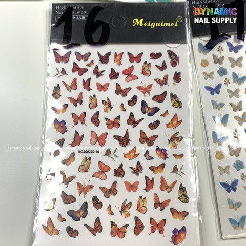 A sheet of butterfly stickers for nail art design showcases an array of small, vibrant butterflies. These stickers are organized in rows and feature shades of red, orange, and yellow, with the brand Dynamic Nail Supply prominently displayed at the top of the packaging.