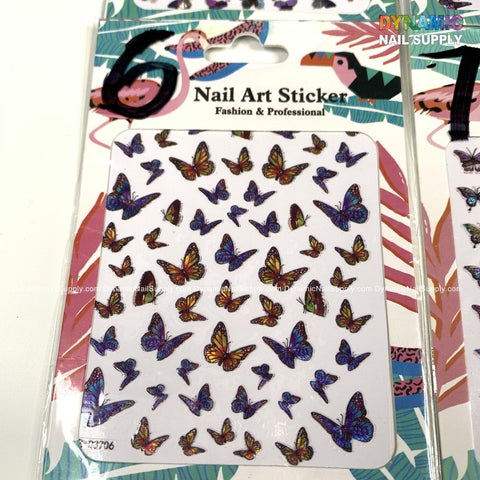 Introducing the Dynamic Nail Supply Butterfly Stickers for Nails Art Design, an ideal choice for imaginative nail creations. These eye-catching butterfly stickers, complete with tropical leaf backgrounds and a subtle appearance of the Dynamic Nail Supply logo, come elegantly arranged on a white card within clear packaging.