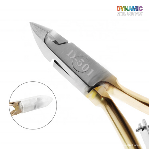 A close-up of the D501 Professional Stainless Steel Cuticle Nipper shows it as an essential tool in any manicure set, featuring sharp, angled blades and a gold-tone handle. The model number D501 is engraved on one blade, while an inset highlights a side view of the nipper's cutting edge. Dynamic Nail Supply's vibrant logo is prominently displayed in the top right corner.