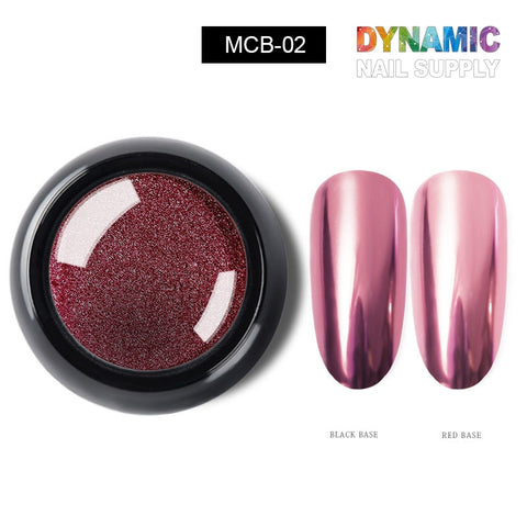 A container of metallic chrome pigment for nail design labeled MCB-02. Two elongated nail swatches display the captivating chrome effect: the left swatch shows a dark shade over black, while the right reveals a pink hue over red. Branding reads Dynamic Nail Supply, perfect for creating stunning nail art designs.
