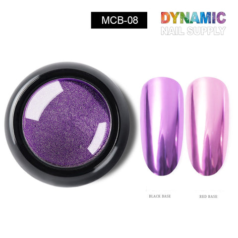 A round container featuring the Metallic Chrome Pigment for Nail Design, labeled MCB-08, from Dynamic Nail Supply is displayed. Two elongated oval nail samples demonstrate its effect: one over a black base showcases a metallic purple finish, while the other over a red base presents a lighter, iridescent pink-purple sheen. The branding "Dynamic Nail Supply" is positioned above.