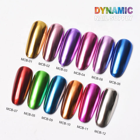 A collection of twelve vibrant nail polish colors, with labels ranging from MCB-01 to MCB-12, includes stunning shades such as gold, pink, and a striking chrome effect silver. Ideal for any nail art design, this display prominently showcases the Dynamic Nail Supply logo in the top right corner.